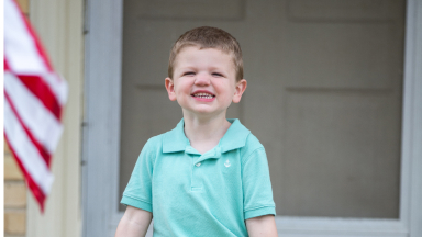 Kid smiling.