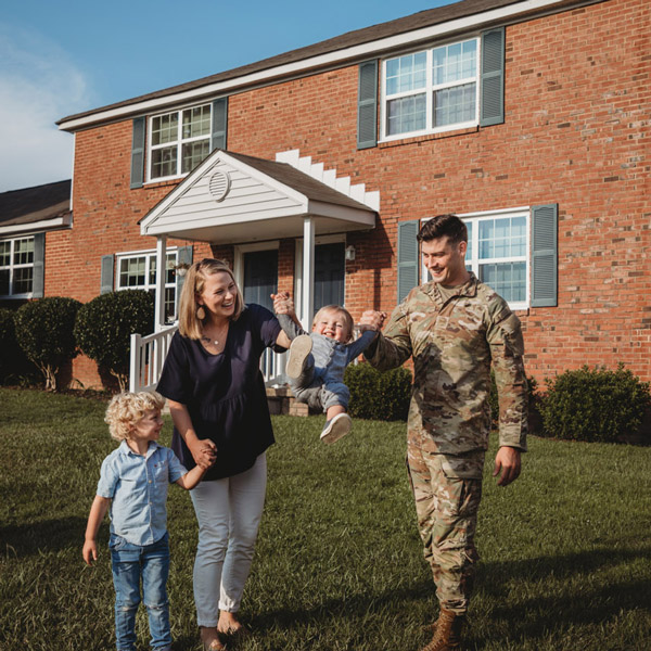 Military Family Posing in front of Home