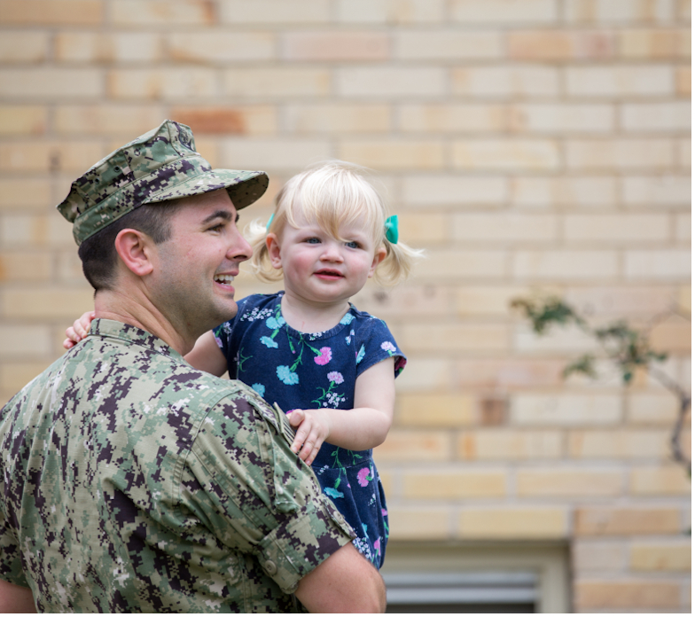 Marine holding his daughter