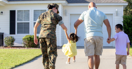 service member with her husband and kids