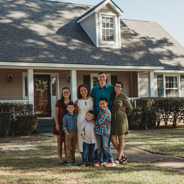 Military Family Posing in front of Home